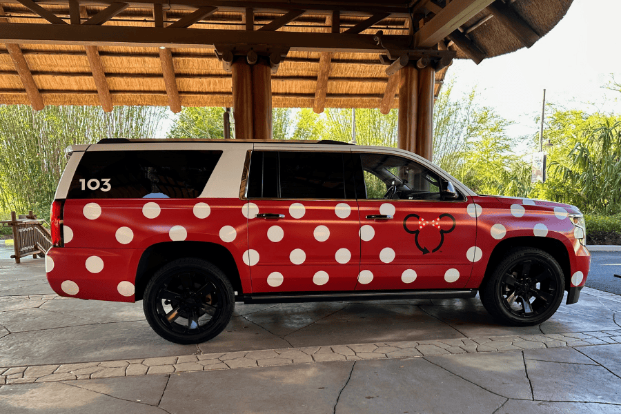 Disney Minnie Van transportation service suburban with red and white polka dots