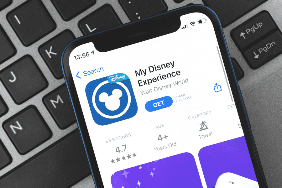 picture of phone and My Disney Experience app guide on app store